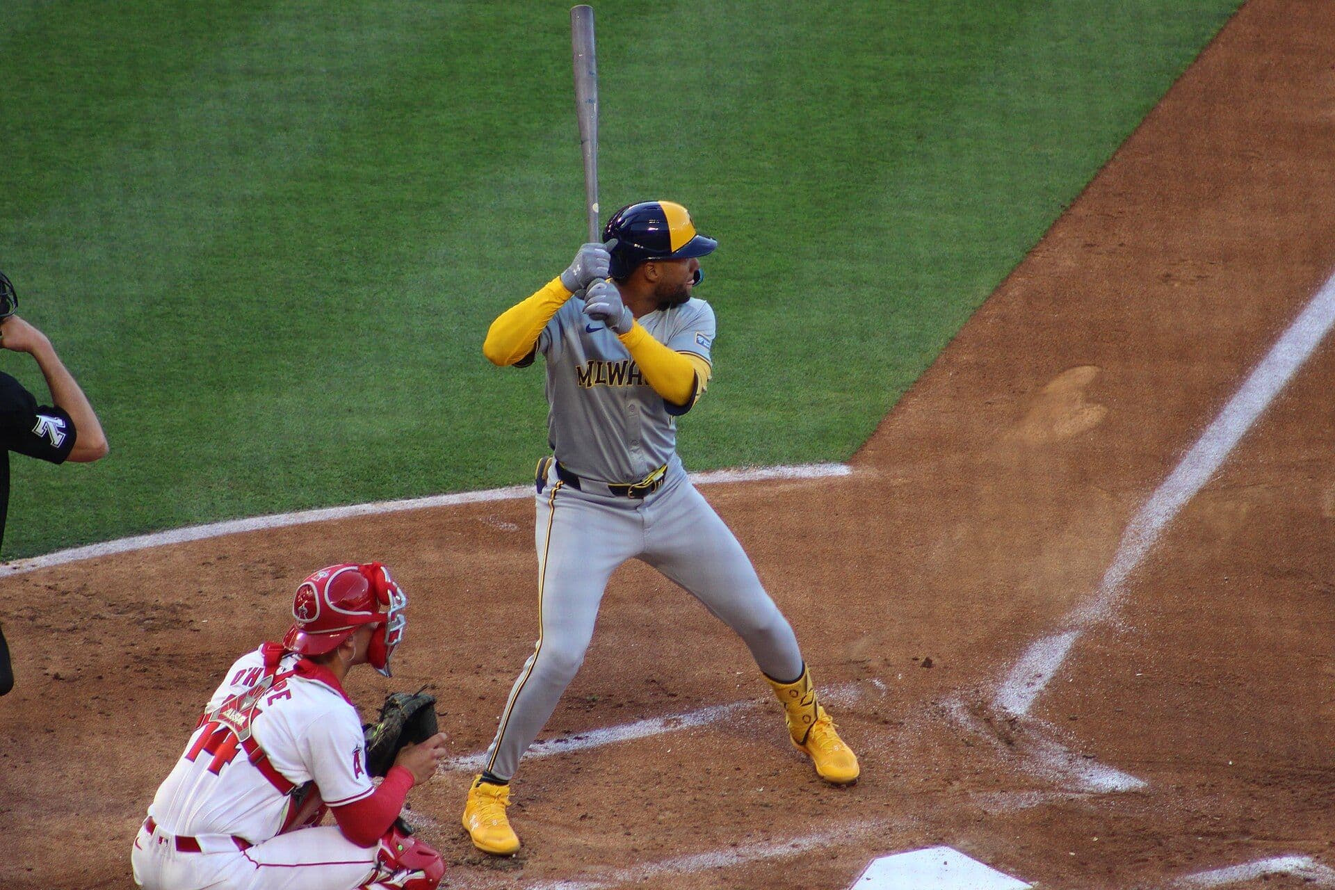 Milwaukee Brewers outfielder Jackson Chourio stands in his batting stance in a gray road uniform.