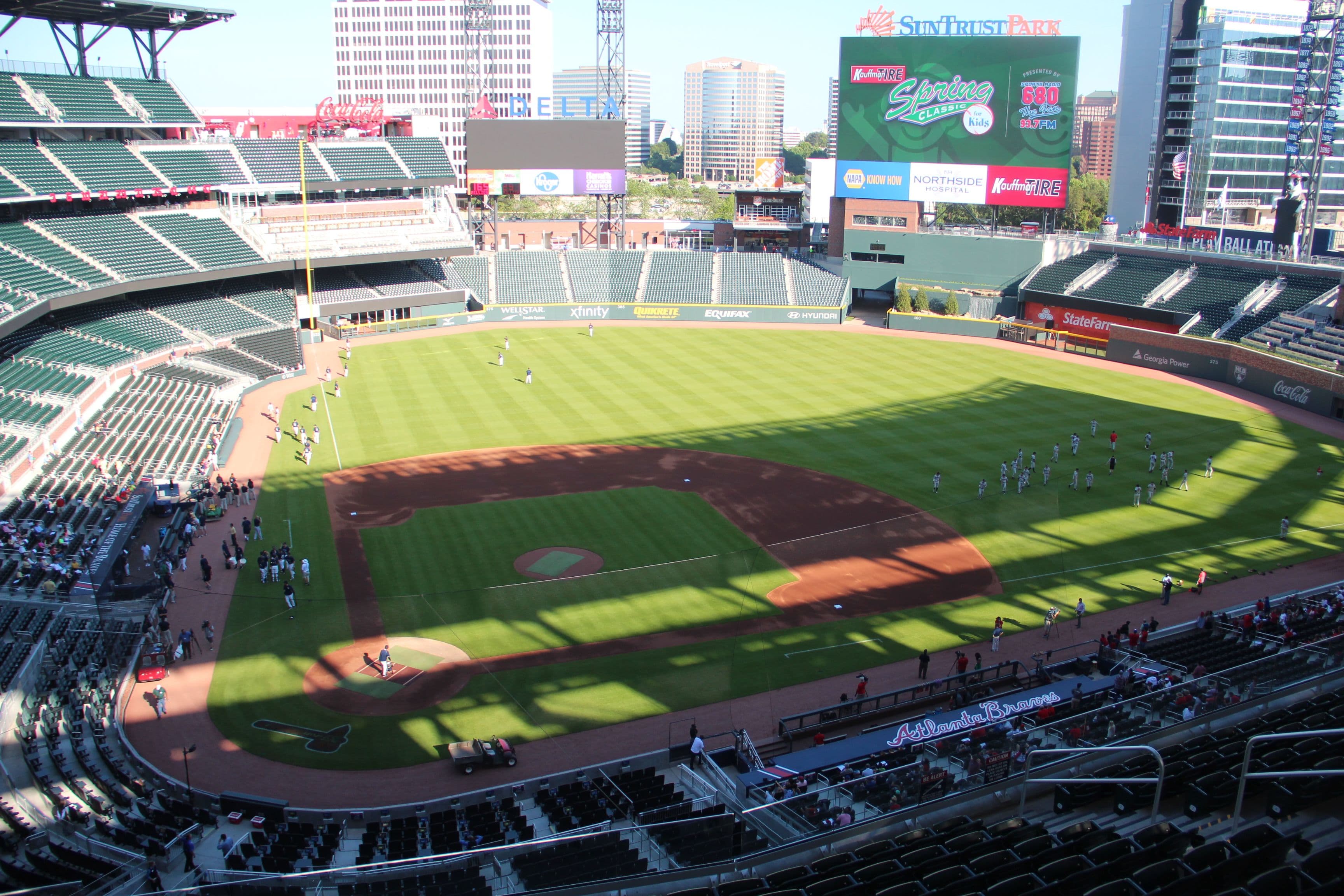 View of the baseball field at Truist Park in Atlanta from the upper deck behind home plate, with the stands filled during a game.